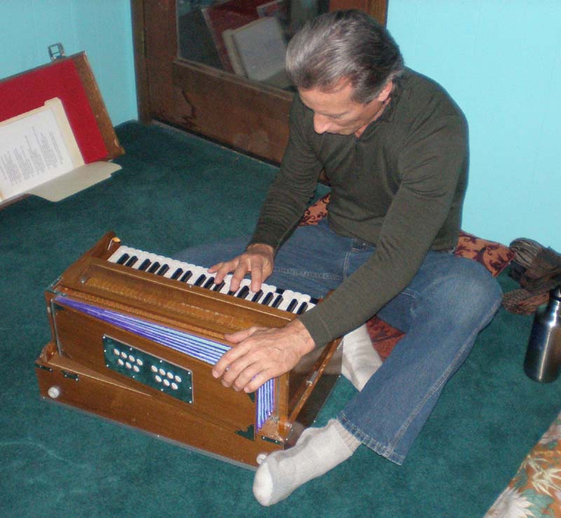 73playing_harmonium